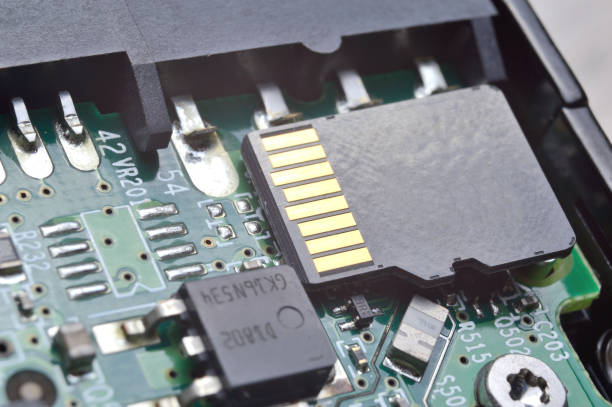 istock the black micro sd card lies on the microcircuit. close-up. 1365895170