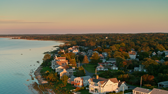 Drone shot of Cape Cod Bay at sunset on a sunny day in Fall, close to the town of Barnstable. 

Authorization was obtained from the FAA for this operation in restricted airspace.