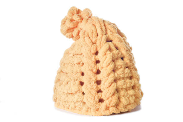 istock yellow winter knitted wool hat isolated on white background 1365896472
