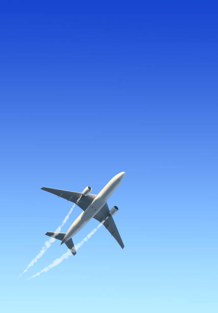 istock Vertical nature background with aircraft and Jet trailing smoke in the sky. Airplane and condensation trail 1365896708