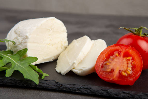 istock Fresh tasty mozzarella close-up. Concrete grey background. 1365897097