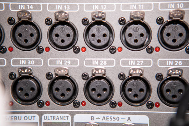 instrument audio jack connectors inserted into channels on a mixing desk in a recording studio. - recording studio sound recording equipment record interconnect imagens e fotografias de stock