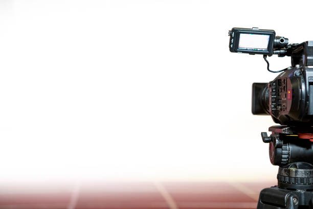 Video camera taking live video streaming with people working background at meeting room. Selective focus. stock photo.
