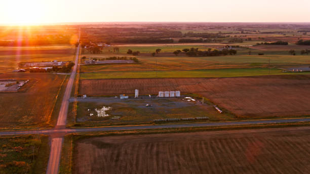 istock Sun Setting Over Farmland and Fracking Equipment in Rural Oklahoma 1365899278
