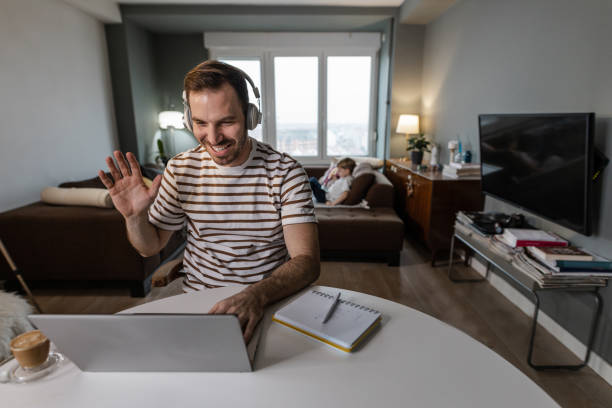 istock Mid adult man working at home 1365899452