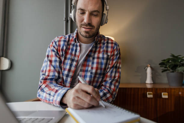 istock Mid adult man working 1365899561