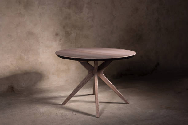 istock Beautiful brown wooden folding table on beige concrete background 1365900593