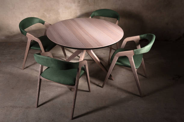 istock Beautiful brown wooden folding table on beige concrete background 1365900602