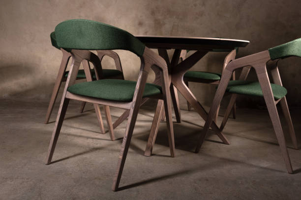 istock Beautiful brown wooden folding table on beige concrete background 1365900620