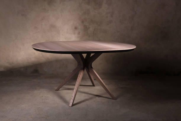istock Beautiful brown wooden folding table on beige concrete background 1365900623