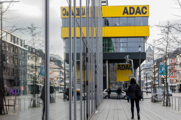 front of the local adac office. adac is europe's largest association for motoring,  motorsport and tourism interests - motoring imagens e fotografias de stock