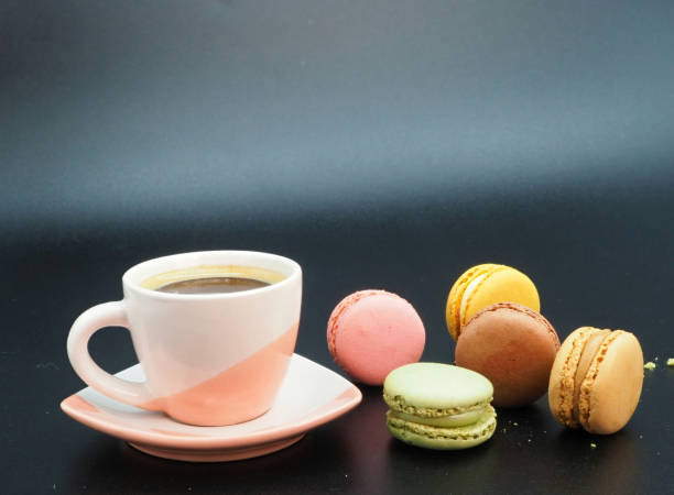 istock Cup of coffee and macaroons 1365903381