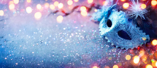 istock Carnival Mask - Party Masquerade With Abstract Defocused Bokeh Lights On Shiny Confetti 1365903911