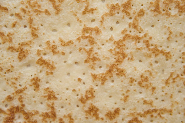 istock Pancake texture background. Pancake surface pattern macro view. Traditional russian sweet dessert. 1365905675