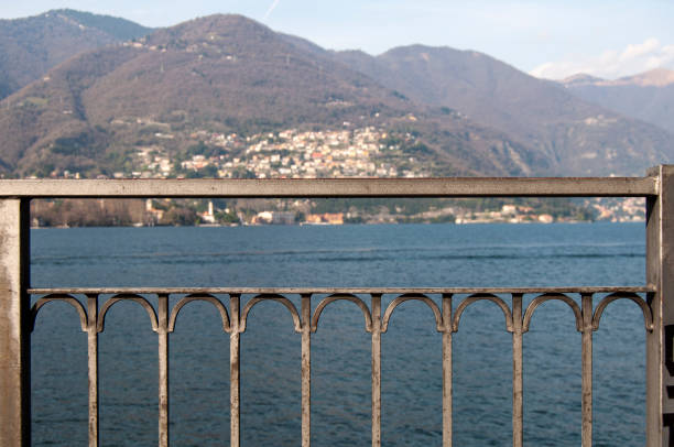 istock Mountain and lake view behind the metal bars 1365909120