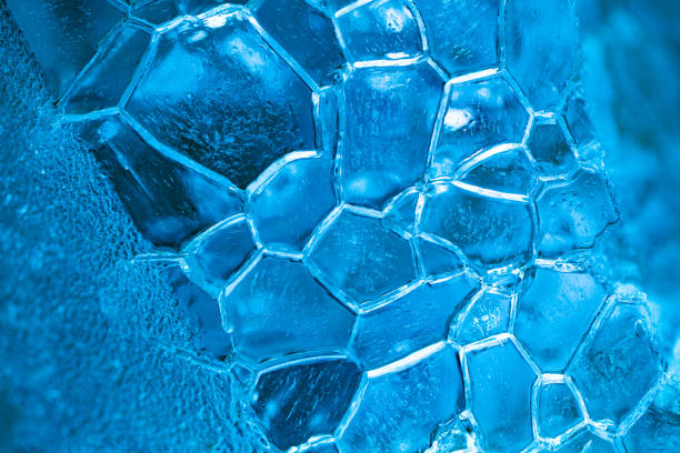 closeup of ice with colourful backlight for design purpose, textured background