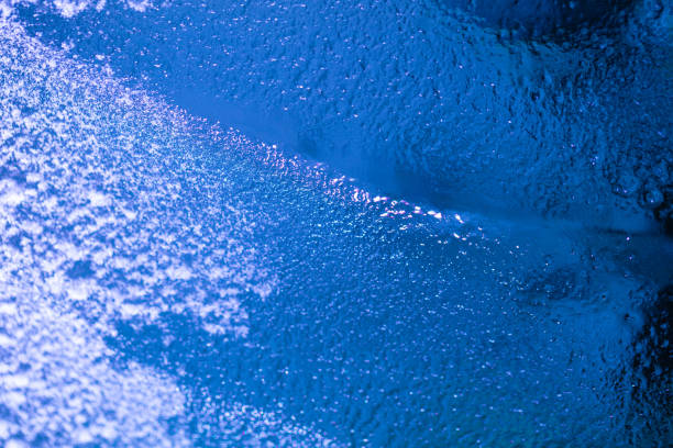 istock closeup of ice with colourful backlight for design purpose 1365915004
