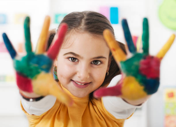 istock Little girl playing with watercolors 1365915131