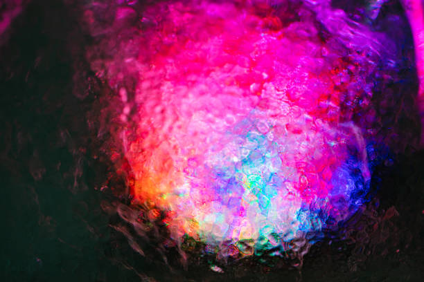closeup of ice with colourful backlight for design purpose, textured background