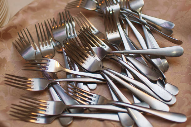 istock Many steel forks scattered randomly on the table 1365915206