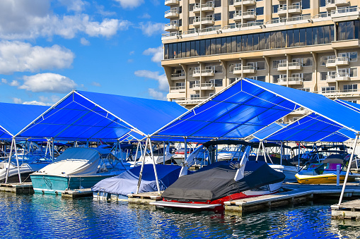 Boats in a covered slip at a resort marina