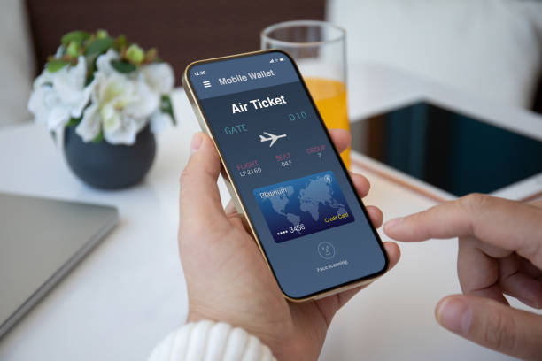 istock male hands holding phone with airplane ticket application airlines screen 1365917989