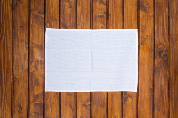 top view of napkin or dish towel on empty wooden table - pano da cozinha imagens e fotografias de stock