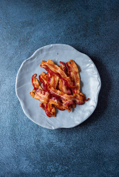 istock Overhead view of fresh cooked bacon 1365918096