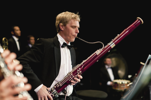 Bassoon player in orchestra
