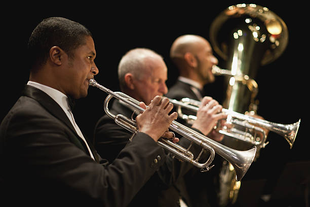 trumpet players in orchestra - trompet stockfoto's en -beelden