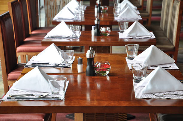 istock Hotel cafeteria wood tables and chairs 136591931