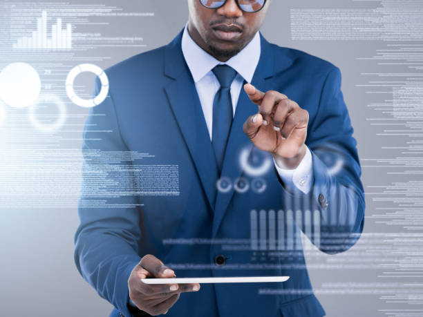 istock Cropped shot of an unrecognizable businessman using his tablet to open a virtual interface in studio against a grey background 1365921540