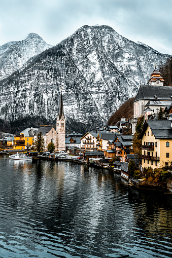 Scenic picture-postcard view of famous Hallstatt mountain village in the Austrian Alps at beautiful light during the winter