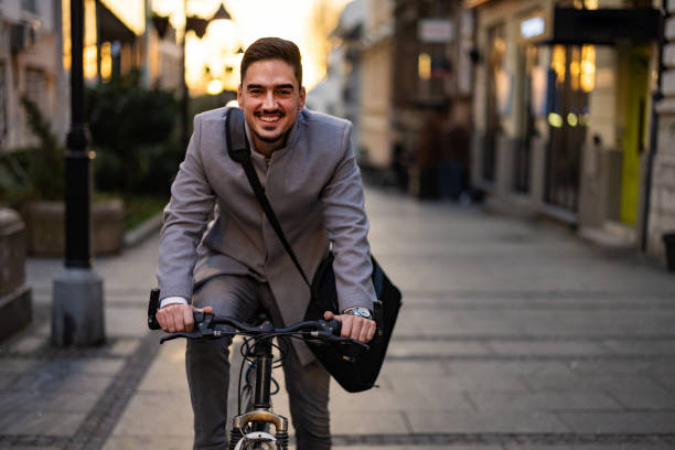 istock Businessman biking to office 1365924800