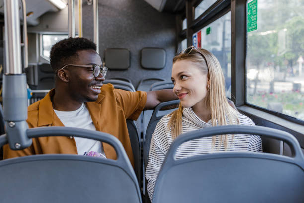 istock Passengers in public bus looking through the window 1365929554