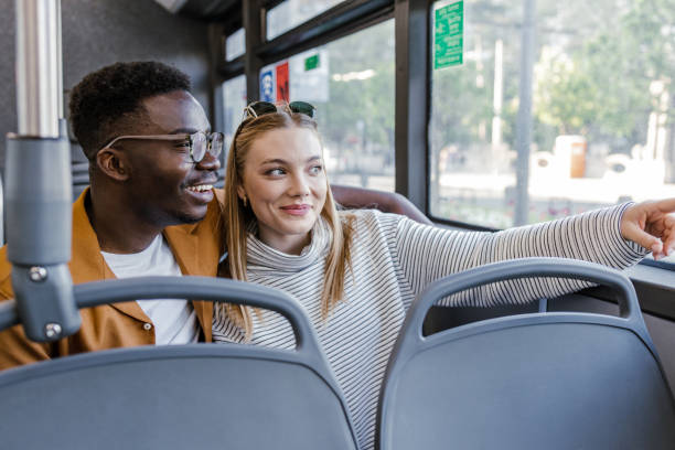 istock Passengers in public bus looking through the window 1365929628