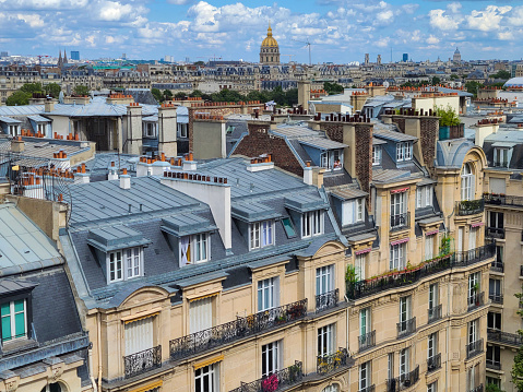 Paris, France city view with rooftops in foreground. Napoleon's tomb in background. Cityscape.