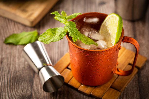 istock Moscow mule cocktail in copper mug on the table. 1365931228