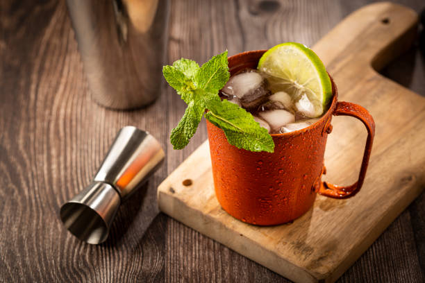 istock Moscow mule cocktail in copper mug on the table. 1365931238