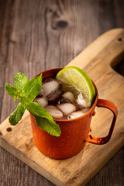 istock Moscow mule cocktail in copper mug on the table. 1365931316
