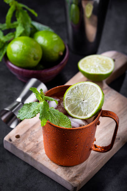 istock Moscow mule cocktail in copper mug on the table. 1365931364