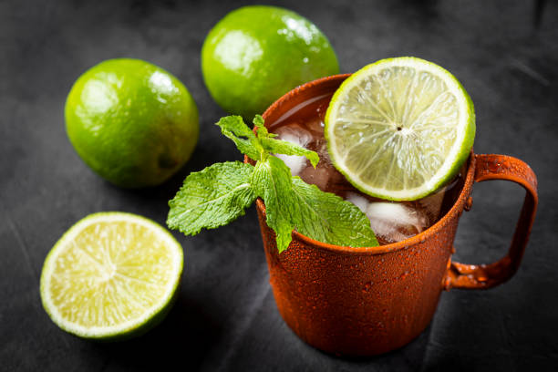 istock Moscow mule cocktail in copper mug on the table. 1365931370