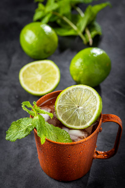 istock Moscow mule cocktail in copper mug on the table. 1365931377