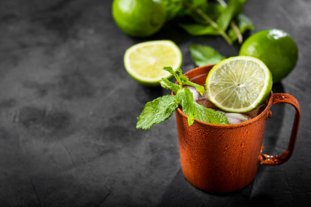istock Moscow mule cocktail in copper mug on the table. 1365931378