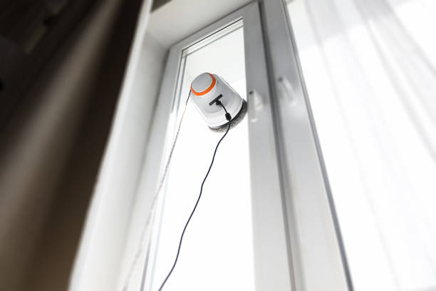 istock Robot window cleaner work on dirty window. Cleaning the house with smart devices. Automatic vacuum robots for cleaning windows, an assistant for the home 1365932438