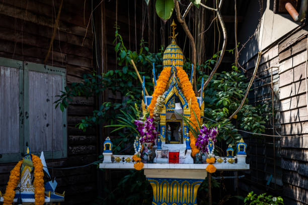 Thai spirit house on display in a residential neighborhood in Bangkok, Thailand.