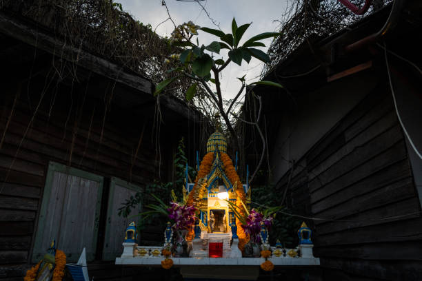 Thai spirit house on display in a residential neighborhood in Bangkok, Thailand.