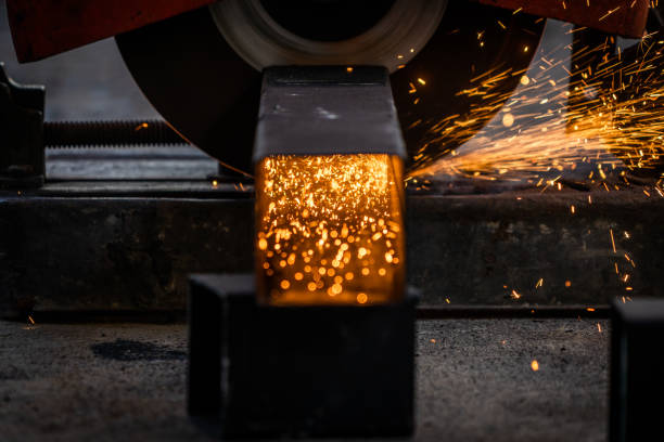 istock Table saw cutting metal with sparks flying 1365933574