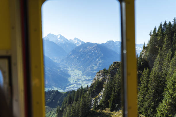 istock View through train window to lake, forest and mountains 1365933768