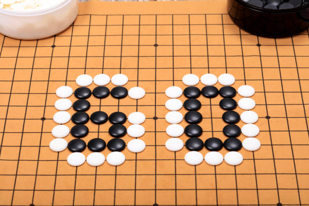 istock chinese game go,  Gobang and go game board 1365935449